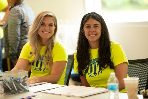 Two admissions employees at new student check-in